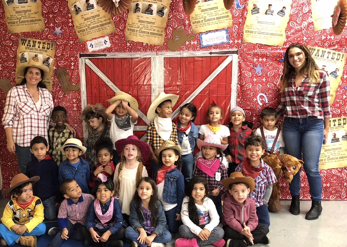 A group of school-age students with their teachers at Growing Together Academy